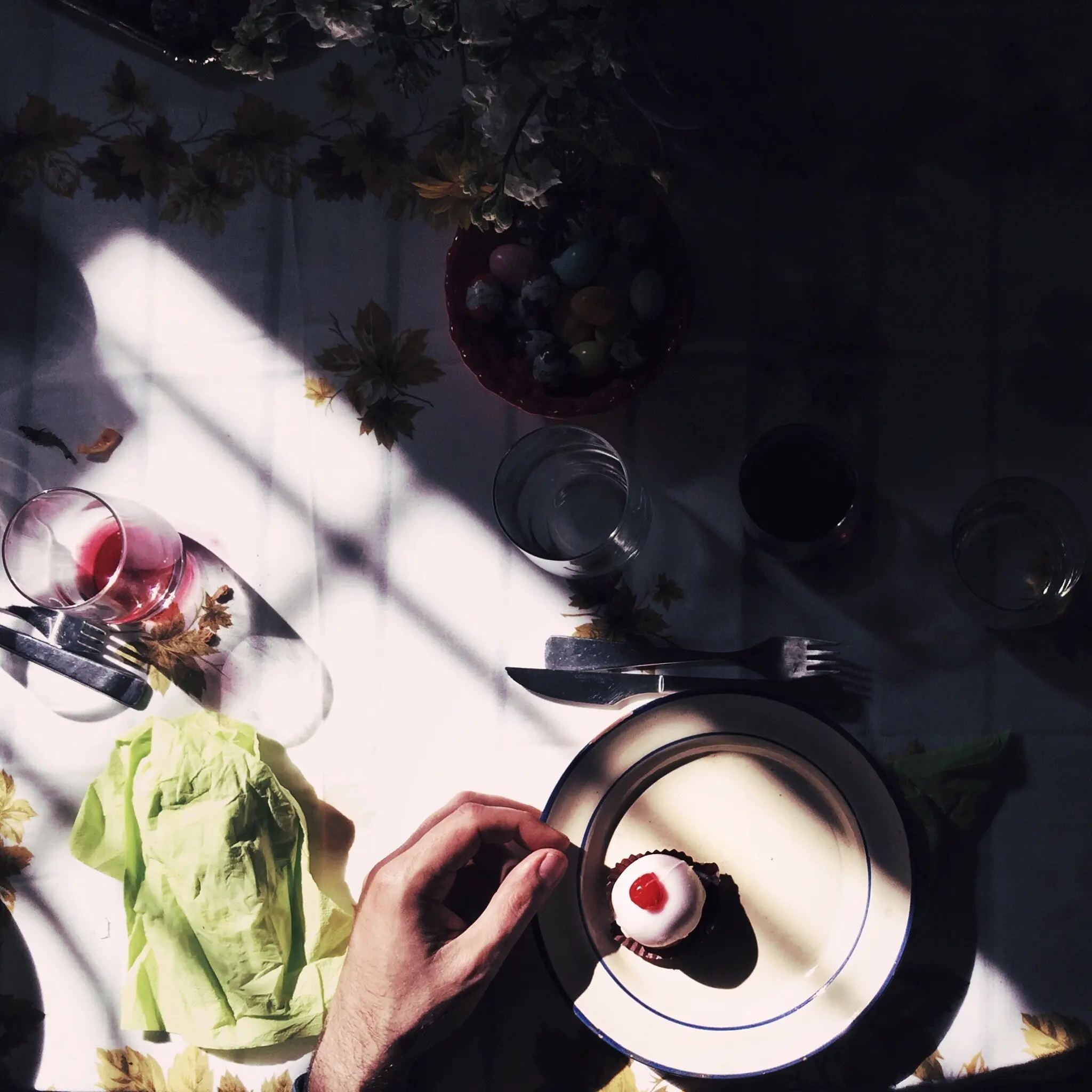 Overhead view of a cupcake on a plate on a table