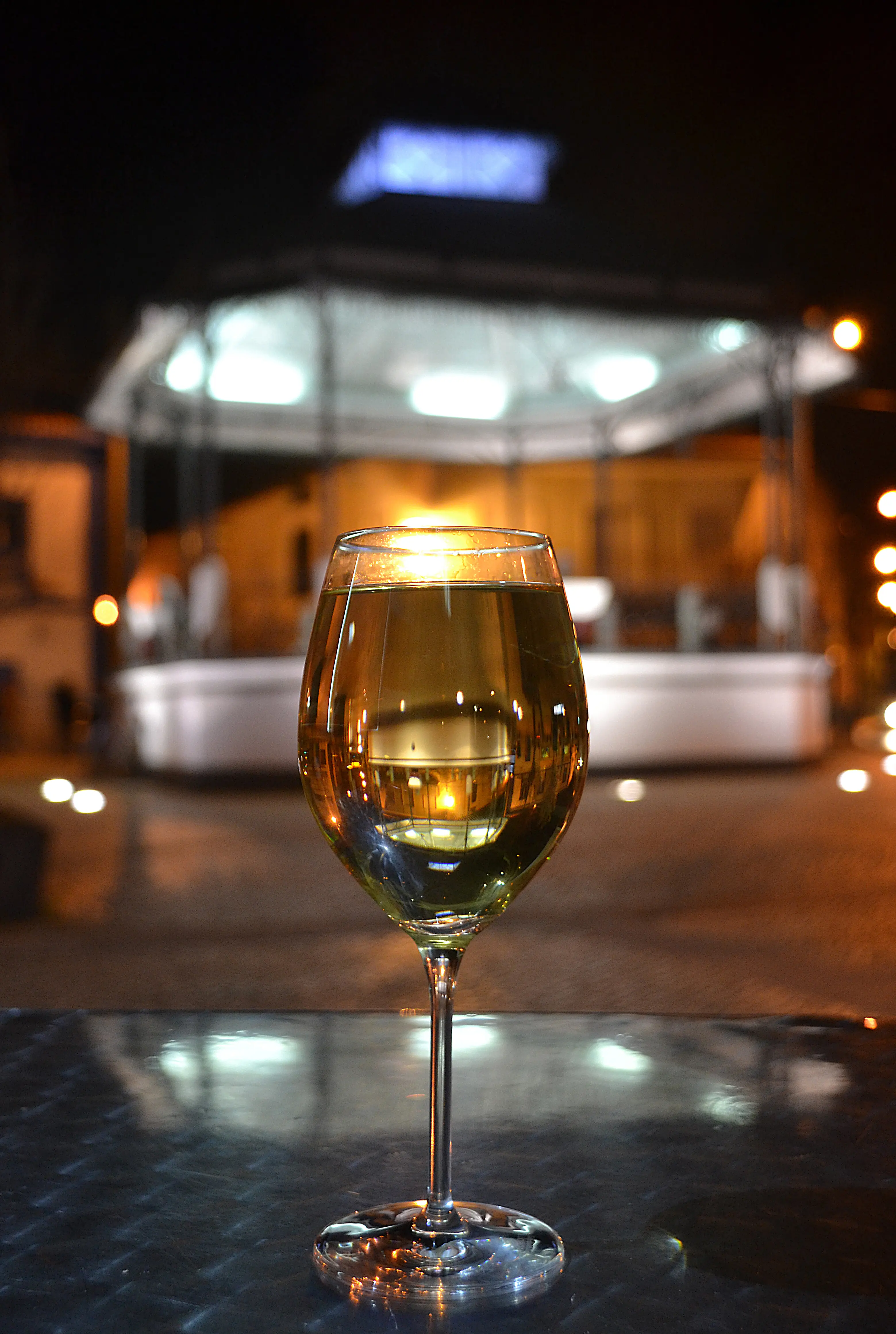 Close-up of a wine glass on a table at a restaurant.
